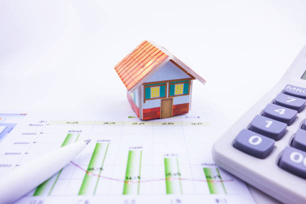 istock There is a small house on the business chart 1178288797