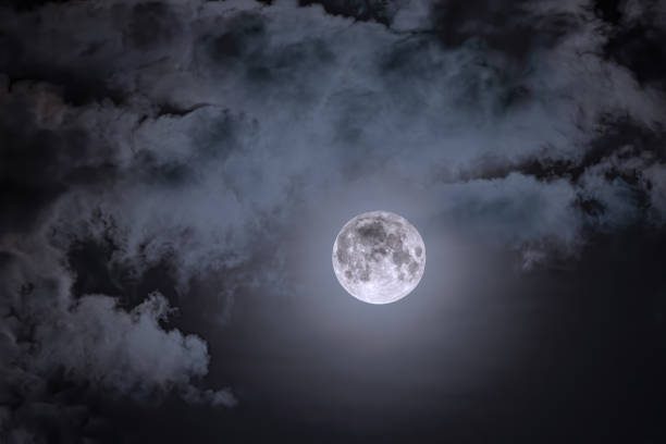 istock Night sky and a full moon in the clouds 1178290281