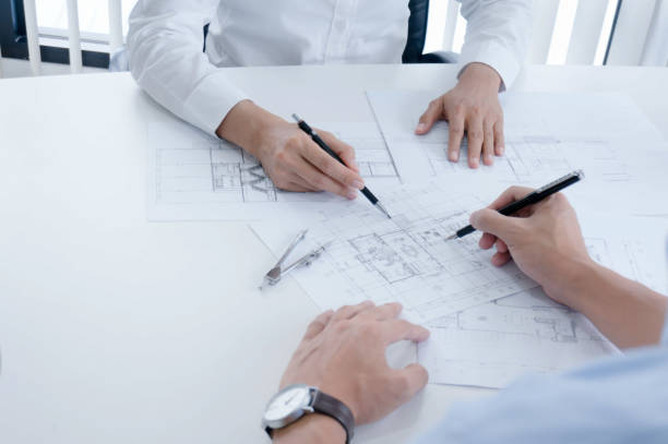 istock Colleagues interior designer Corporate Achievement Planning Design on blueprint Teamwork Concept with compasse. 1178291484