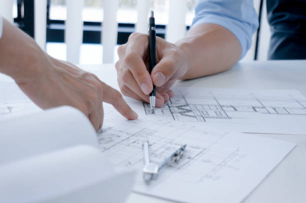 istock Colleagues interior designer Corporate Achievement Planning Design on blueprint Teamwork Concept with compasse. 1178291543