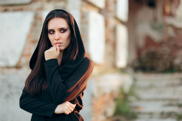 istock Mysterious Evil Vampire in Front of a Horror Abandoned House 1178294321