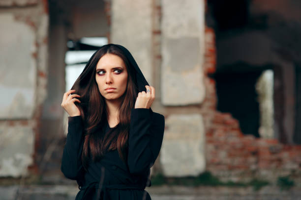 istock Mysterious Evil Vampire in Front of a Horror Abandoned House 1178294381