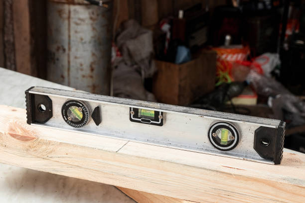 istock Close-up of a building metal level, a ruler lying on the boards. Construction, carpentry work. 1178295452