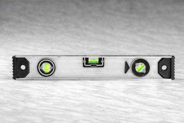 istock Close-up of a building metal level, a ruler lying on the boards. Construction, carpentry work. 1178295462