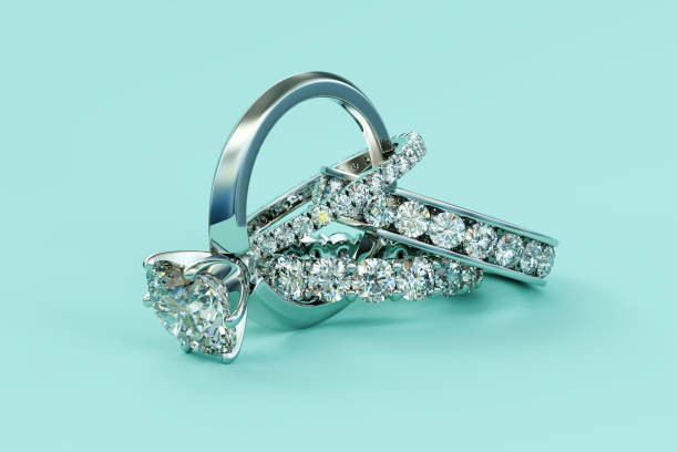 istock Interwoven engagement ring, three eternity rings on turquoise background. 1178297933