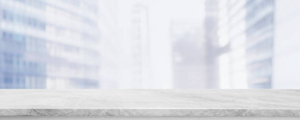 istock Empty white marble stone table top and blur glass window wall building banner mock up abstract background - can used for display or montage your products. 1178300244