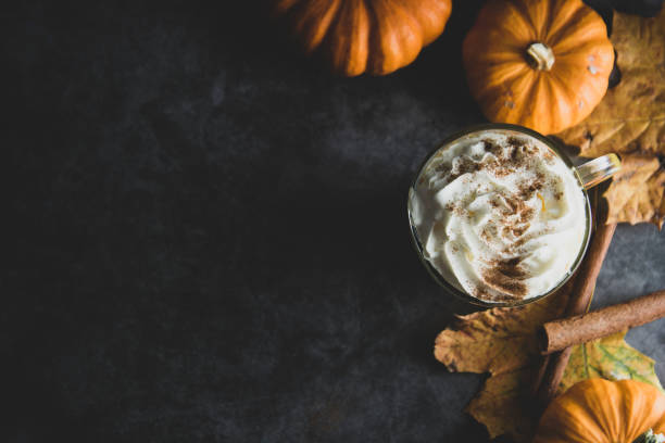 istock Spiced autumn pumpkin latte drink with cinnamon and cream foam top view with copy space fall drink 1178300814