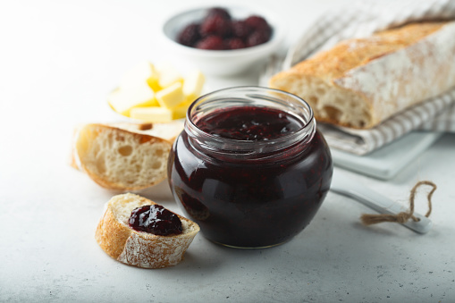 Homemade blackberry jam served with fresh baguette
