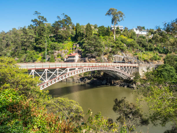 Kings Bridge in Launceston, Tasmania Kings Bridge is a wrought-iron bridge crossing the South Esk River at the mouth of the Cataract Gorge in Launceston, Tasmania. Construction of the bridge began in 1864. launceston tasmania stock pictures, royalty-free photos & images