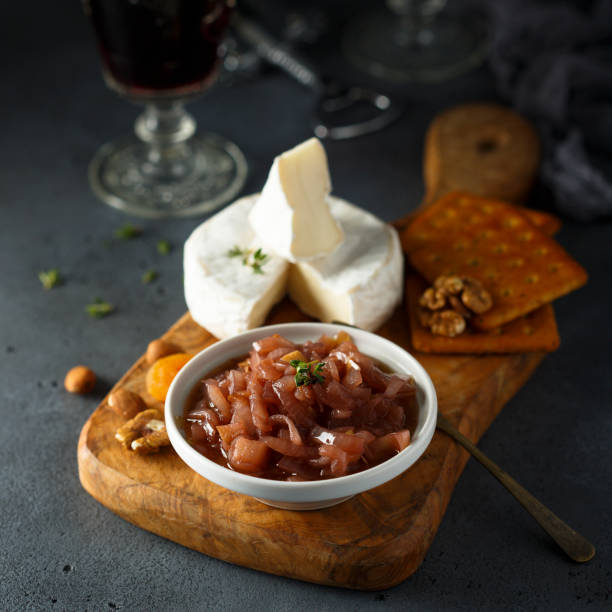 Homemade onion jam Homemade onion jam served with cheese and nuts confit stock pictures, royalty-free photos & images