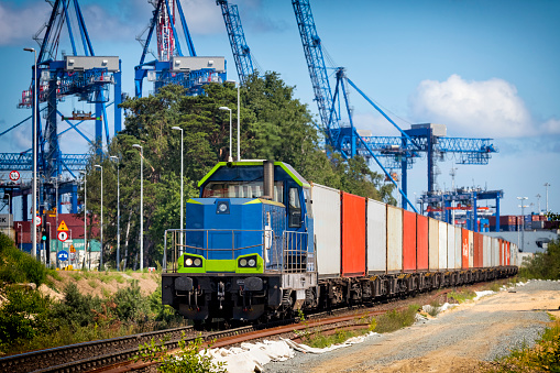 Container freight train goes towards the container terminal, Gdansk, Poland