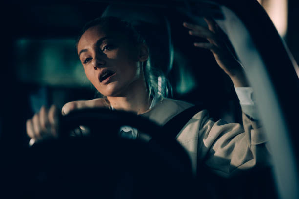 istock Young woman driving at late night 1178303584