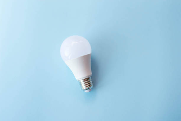 istock electric lamp on blue background , copy space 1178303656