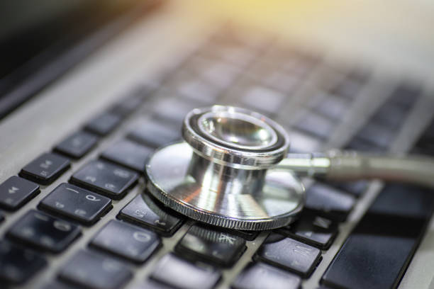 istock A laptop with a stethoscope lying on top of its keyboard with selective focus. 1178305094