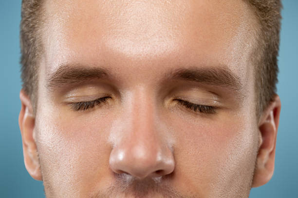 istock Caucasian young man's close up portrait on blue background 1178306122