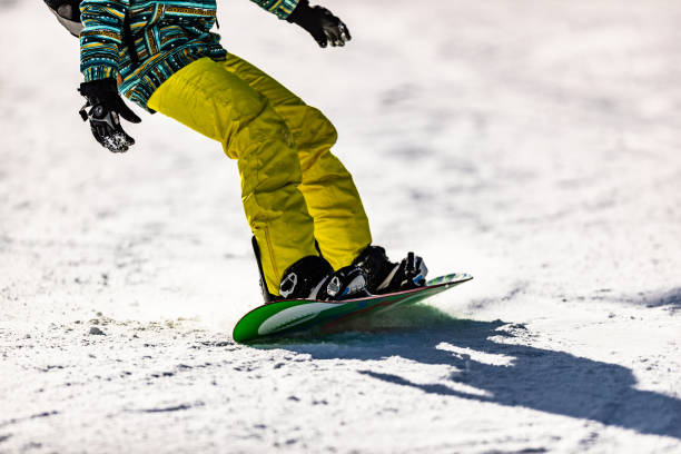 istock Unrecognizable person snowboarding on a mountain. 1178308015