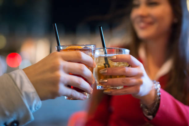 istock People toasting glasses at night 1178308543