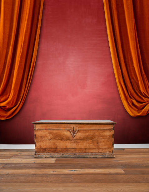 istock Modern interior with old wooden chest against red textured wall 1178309591