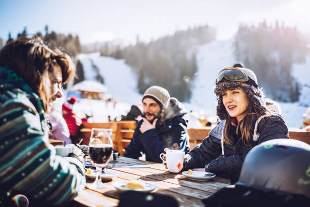 istock Happy skiers talking on a break in a cafe at mountain. 1178312885