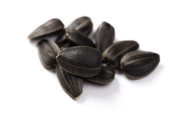 istock Organic Sunflower seeds isolated on white background 1178313006
