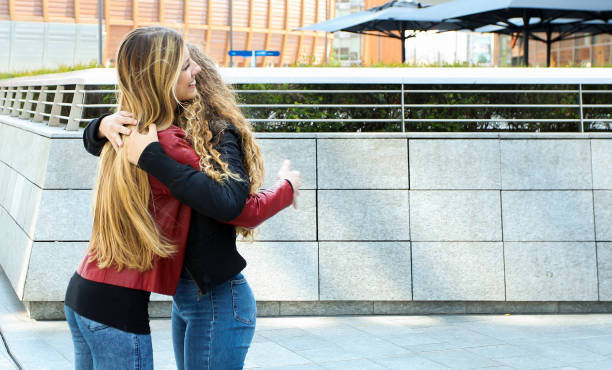 istock Two female friends hugging outdoor 1178313030