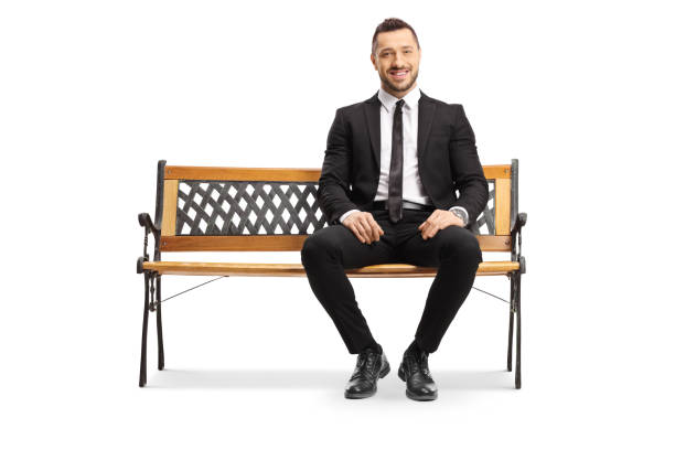 istock Young businessman sitting on a bench and smiling 1178314155