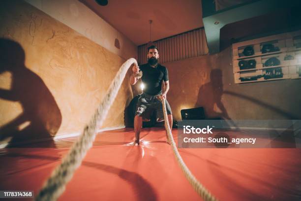 Men Blasting Ropes Man Battling Ropes In The Gym Stock Photo - Download Image Now - Adult ...