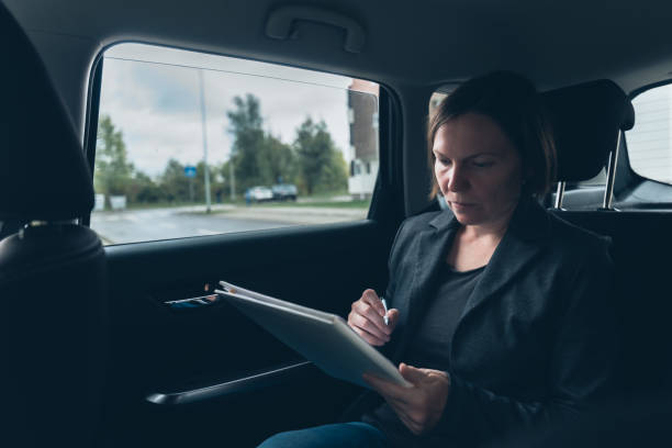 istock Businesswoman doing paperwork and analyzing business report 1178315592