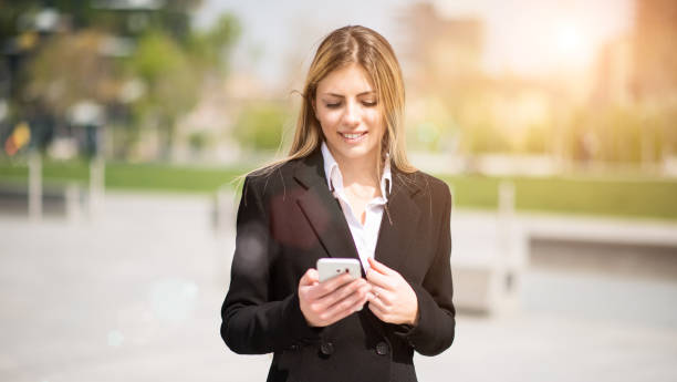 istock Business woman using her mobile phone 1178317865