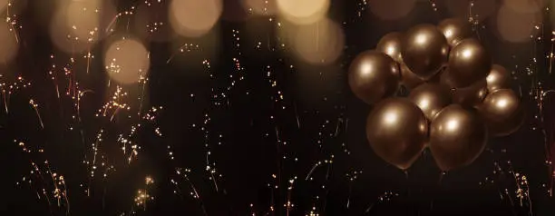 Celebratory bokeh background with laburnum and golden balloons