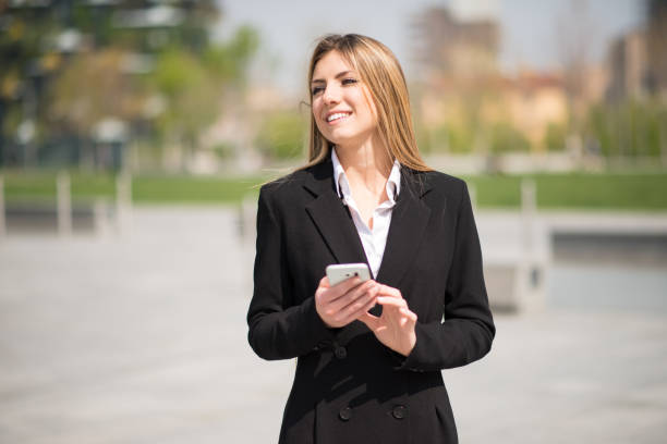 istock Business woman using her mobile phone 1178319148
