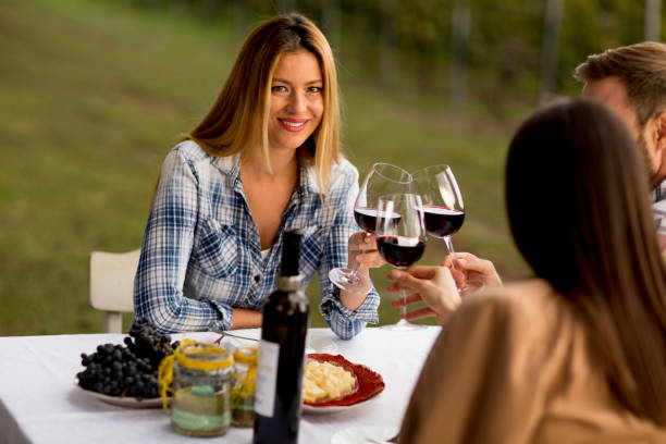 istock Young people by the table in the vineyard 1178321581