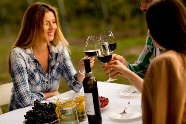 istock Young people by the table in the vineyard 1178321586