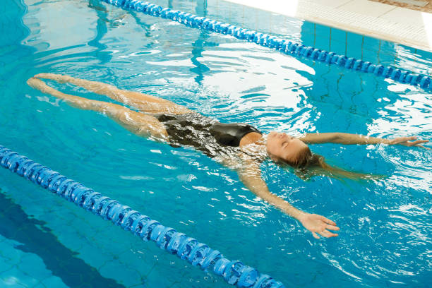 istock Woman swimming on the back 1178325836