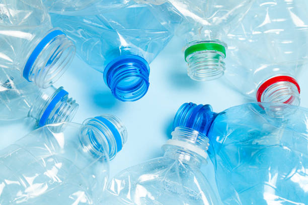 istock Crumpled plastic bottles on a blue background. Plastic trash 1178328660