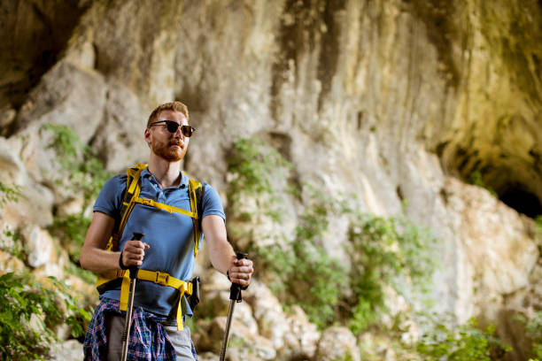 istock Caucasian male hiker with backpack hiking on sunny day 1178328740
