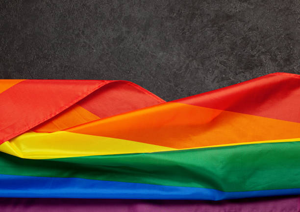 istock LGBT Pride Rainbow Flag. Black background 1178328868