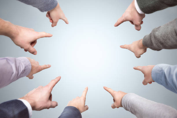 istock Many fingers point to the center 1178329992