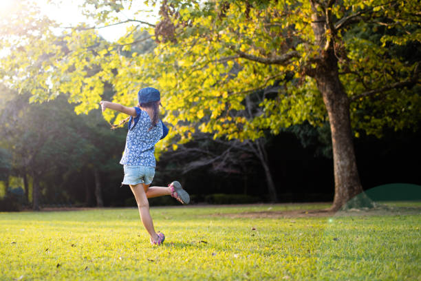 istock Girl dancing on the grass 1178330231
