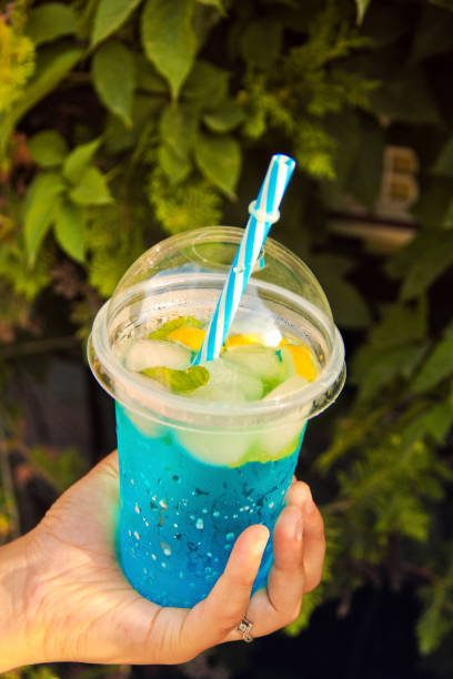 istock Cocktail in a girl's hand. Juicy drink in the hand 1178330708