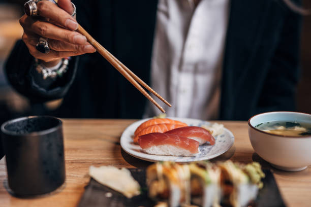 istock Gentleman enjoying in sushi in restaurant 1178331606