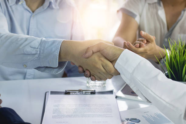 istock Successful constract negotiate and cooperation in acquisition and merger, businessman shake hand with business partner in office 1178333092