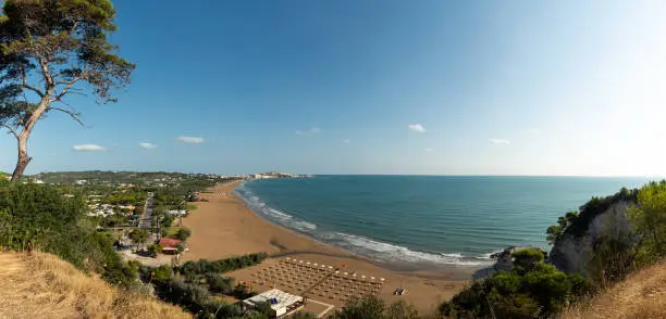 Panorama of Vieste and Pizzomunno beach view in a summer day, Gargano peninsula, Apulia, southern Italy, Europe.