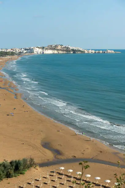 View of Vieste and Pizzomunno beach view in a summer day, Gargano peninsula, Apulia, southern Italy, Europe.