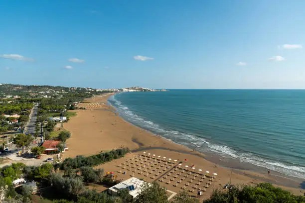 Panorama of Vieste and Pizzomunno beach view in a summer day, Gargano peninsula, Apulia, southern Italy, Europe.