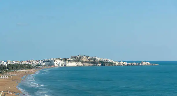 Panorama of Vieste and Pizzomunno beach view in a summer day, Gargano peninsula, Apulia, southern Italy, Europe.