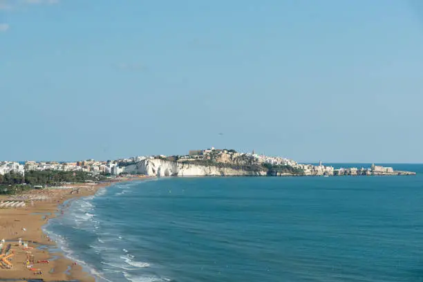 Panorama of Vieste and Pizzomunno beach view in a summer day, Gargano peninsula, Apulia, southern Italy, Europe.