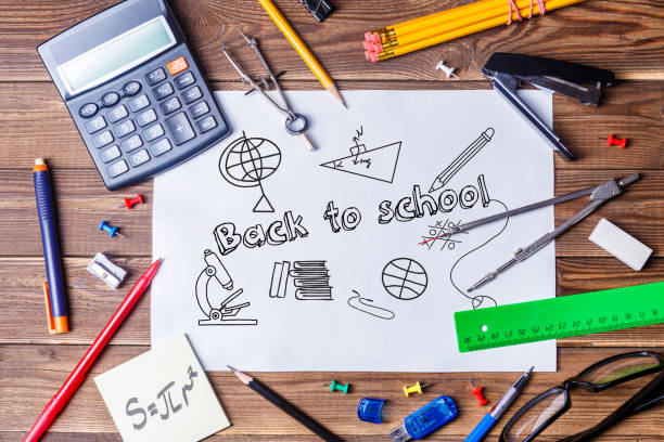 istock Album sheet with text - back to school and student material on wooden table. 1178338342
