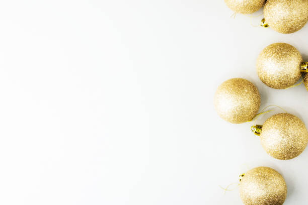 istock Golden christmas balls on grey background with sequins. Christmas composition. Christmas holiday celebration concept, Merry Christmas and Winter holidays. 1178338427