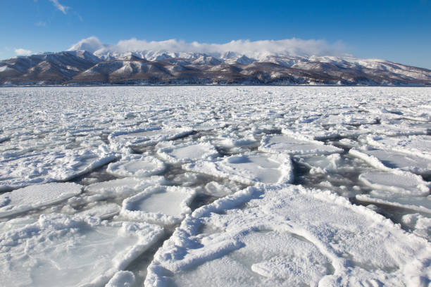 The Sea ice in hokkaido The Sea ice had blown right up to the harbor in hokkaido shiretoko mountains stock pictures, royalty-free photos & images